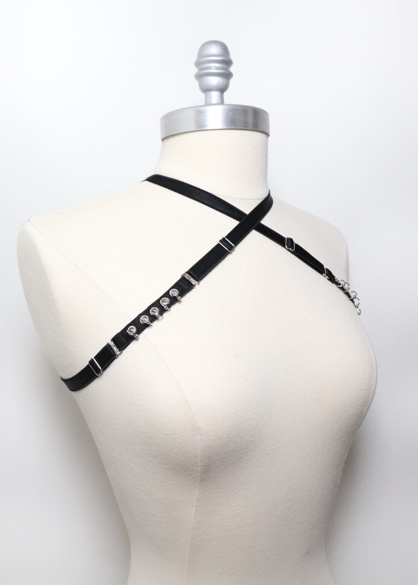 Mini multi-position harness with eyelets and piercings