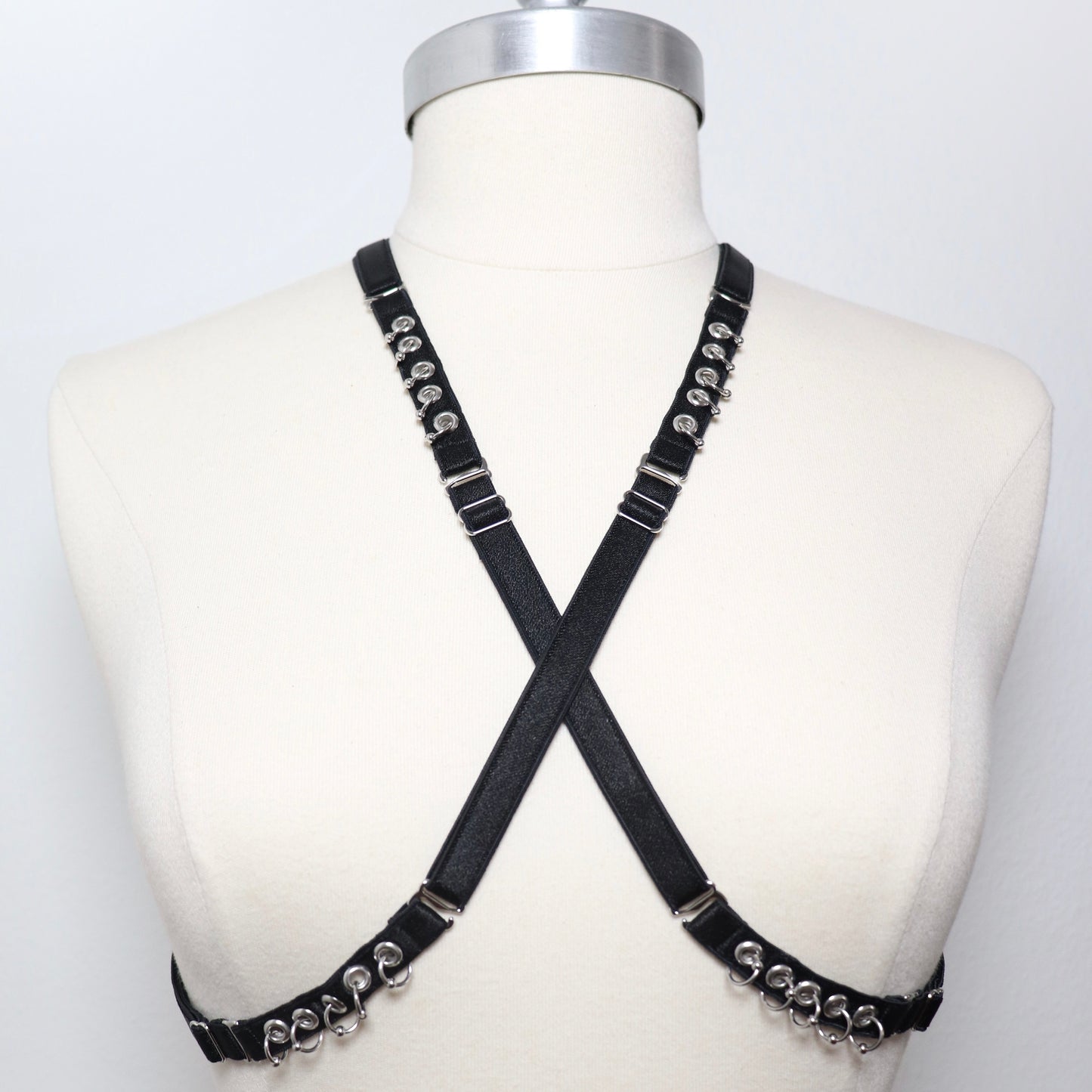 Mini multi-position harness with eyelets and piercings