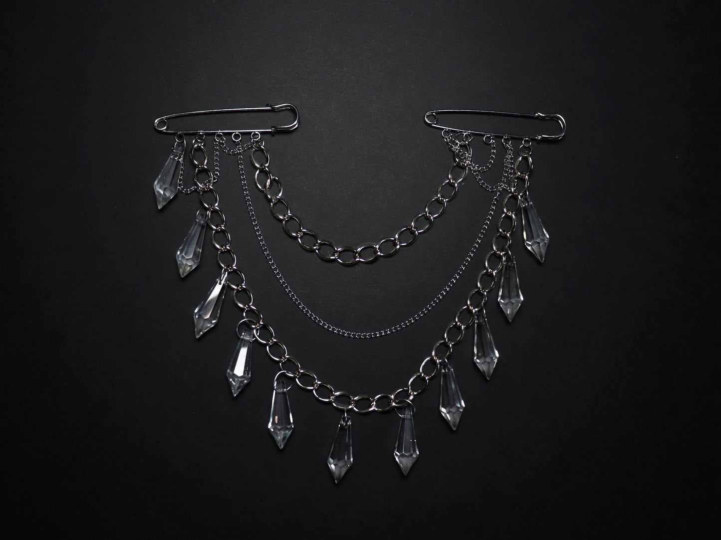 Brooch with chains and glass pendants