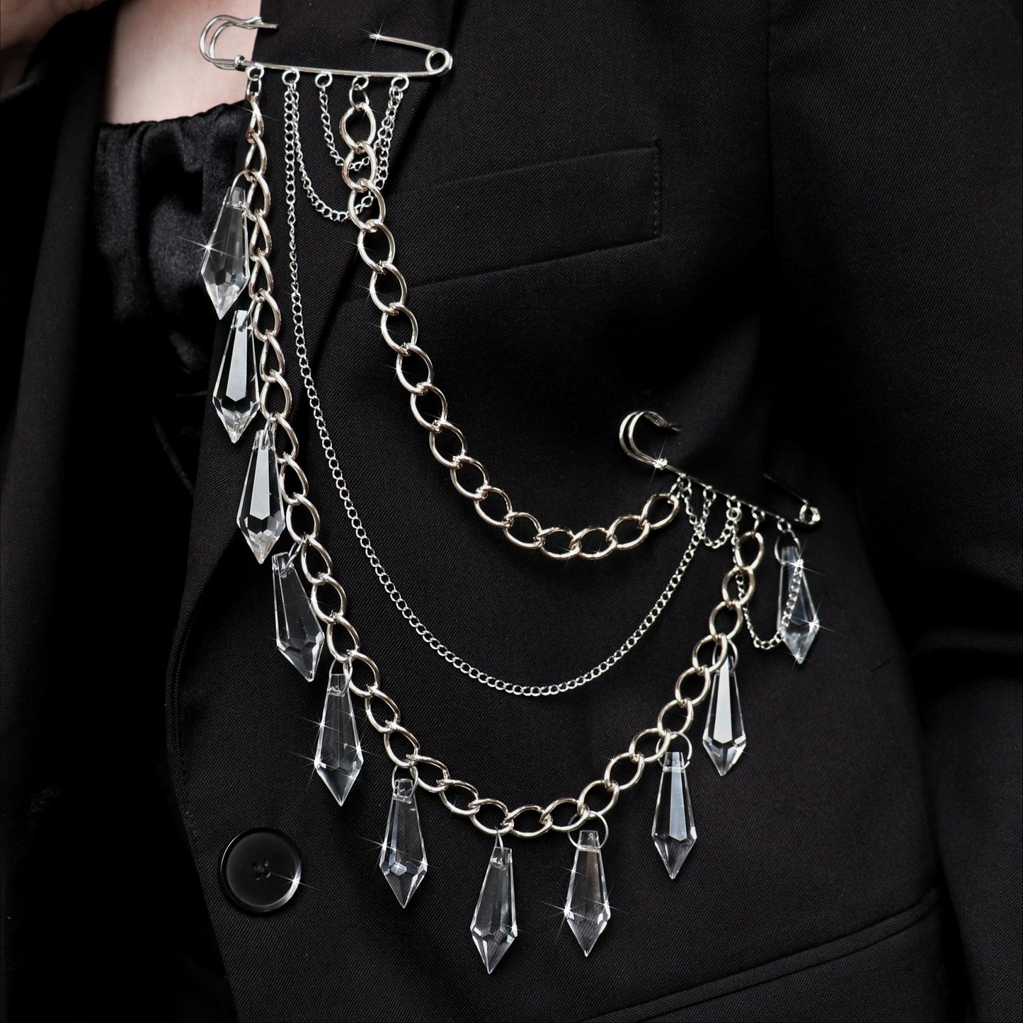 Brooch with chains and glass pendants