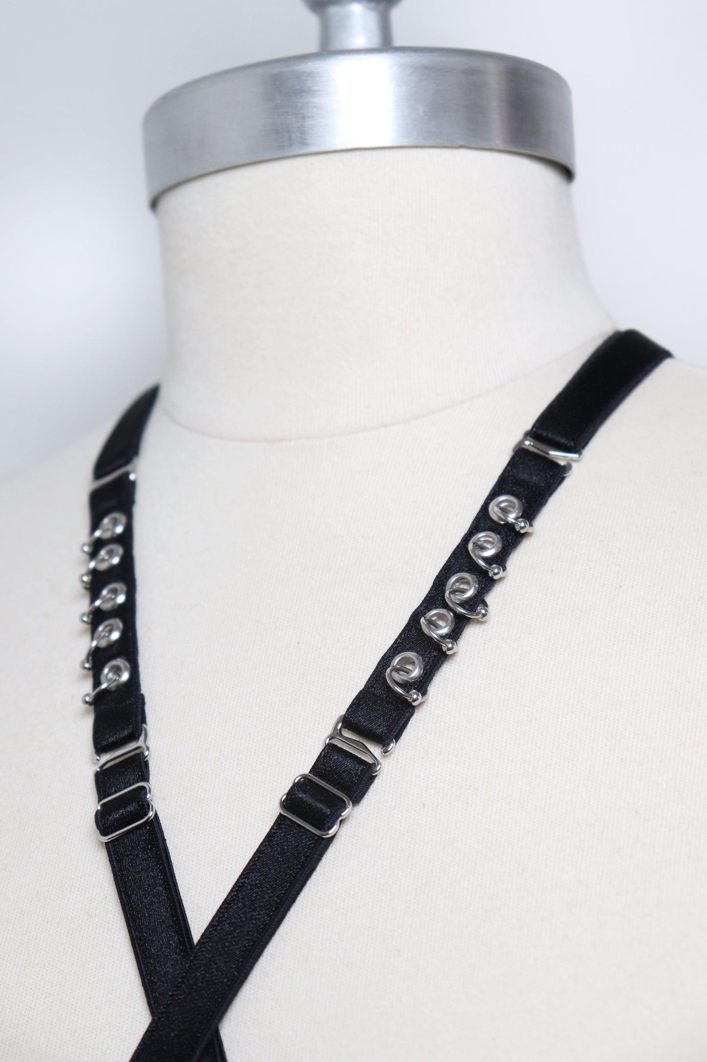 Mini multi-position harness with eyelets and piercings