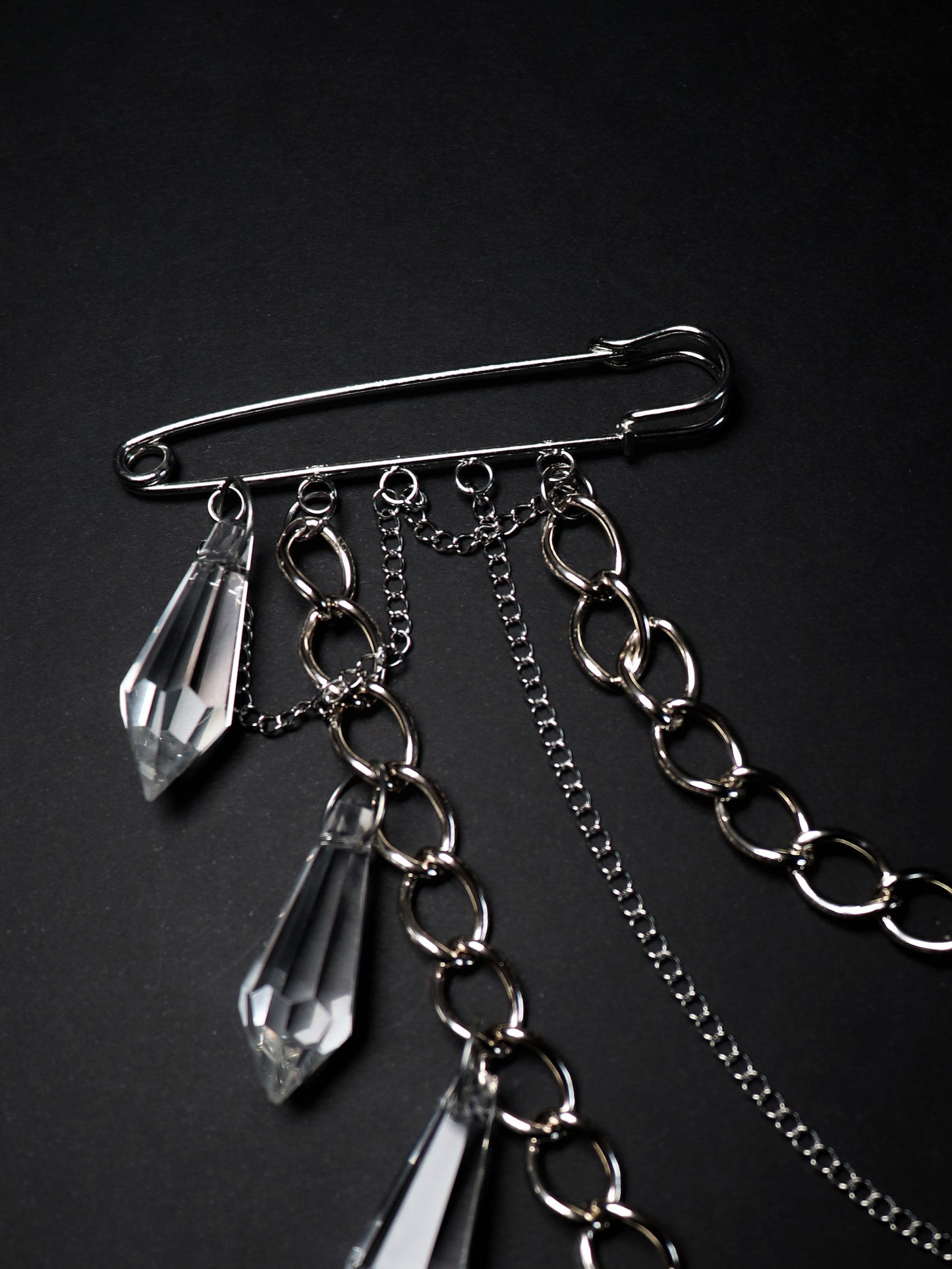 Brooch with chains and glass pendants